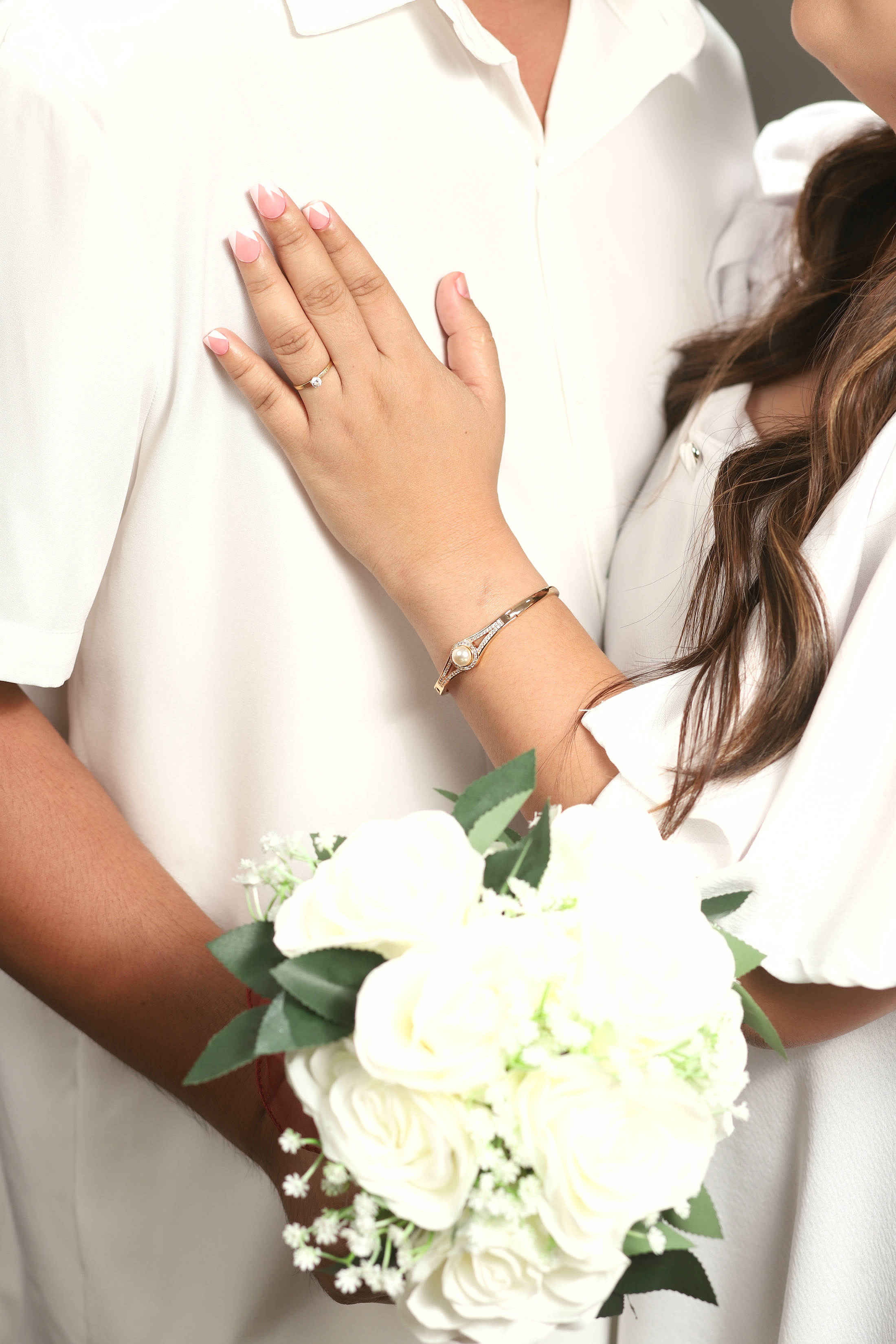 Arlene’s engagement ring and bouquet